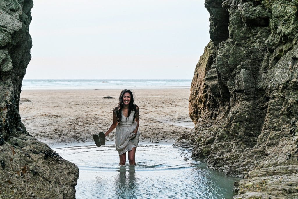 Bride to be braves it through one of perranporths rock pools