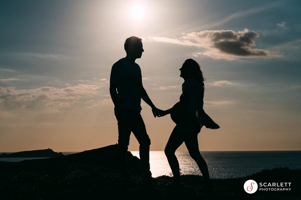 maternity shoot silhouette of couple at porth island