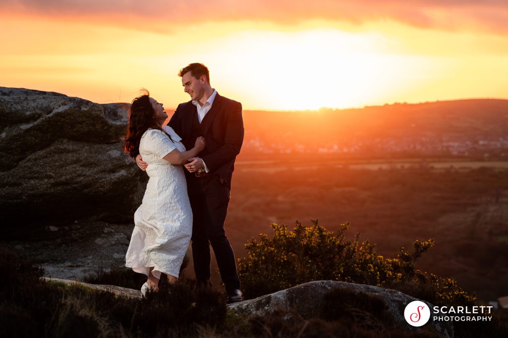 Couple embracing at Carn brae for a Pre-wedding sunrise photoshoot