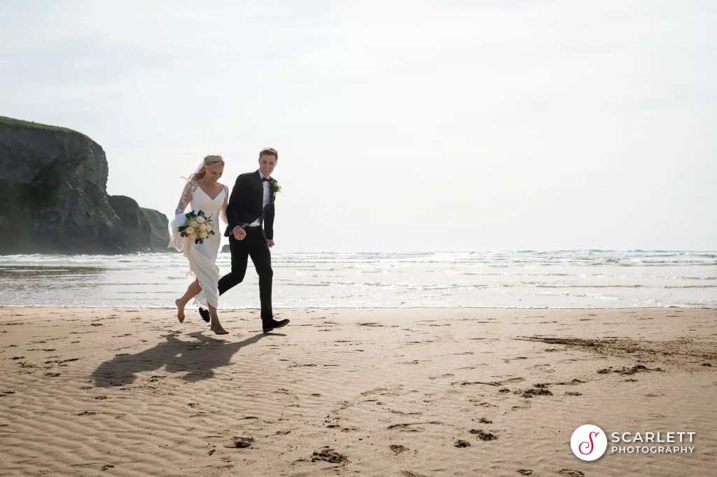 Married Couple Walking on a Sunny Beach
